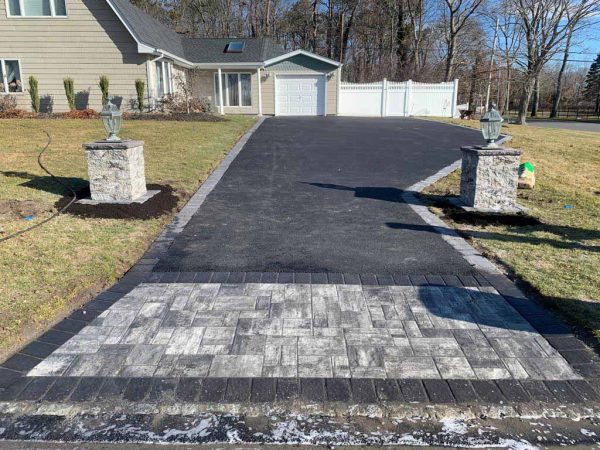 Our asphalt pavers working in Riverhead
